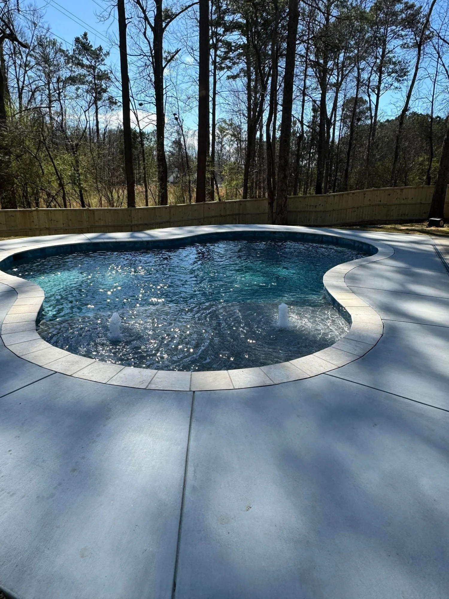 Luxury pool with spa at dusk